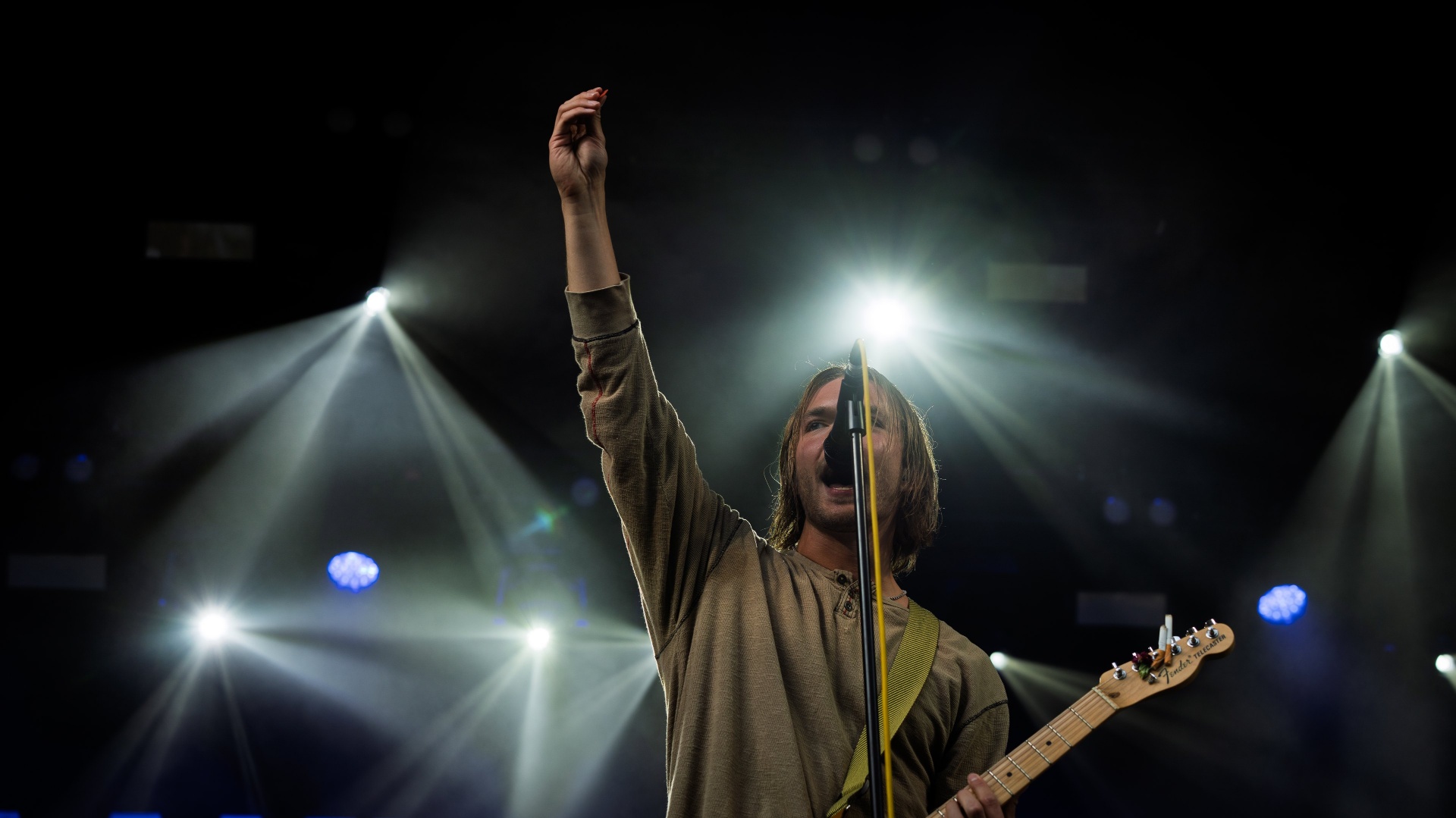 Concert performance — singer under stage lights