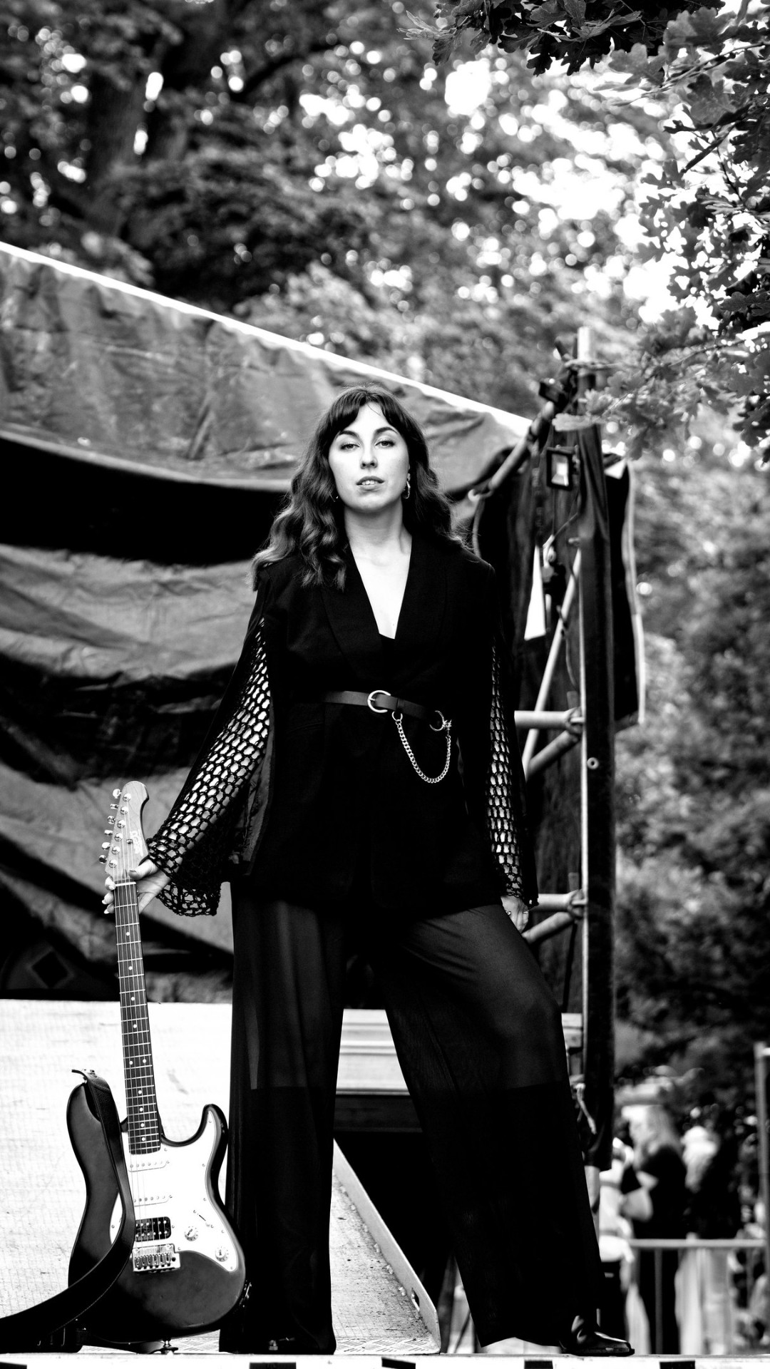 Black and white festival portrait with guitar